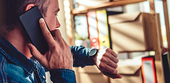 Homeowner on phone discussing mortgage refinance options