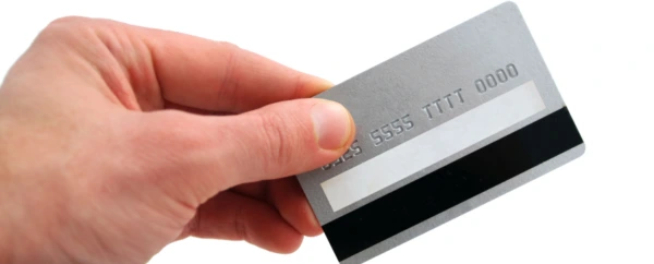 Hand holding silver credit card