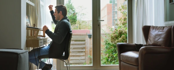 Man cheering at his computer