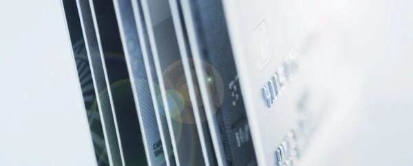 Close up of the side of a stack of credit cards.